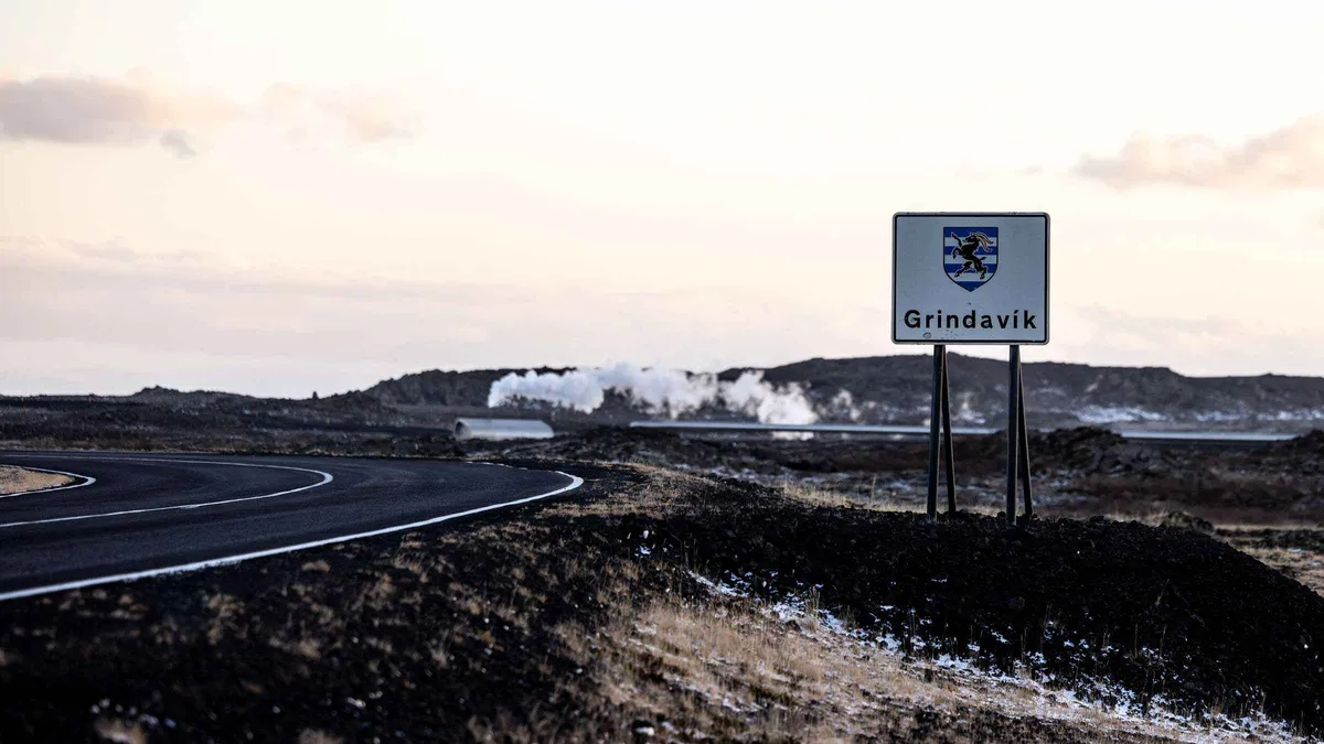 Steam rising from cooled lava at a Fagradalsfjall volcano viewpoint on a guided Reykjanes geopark hiking tour