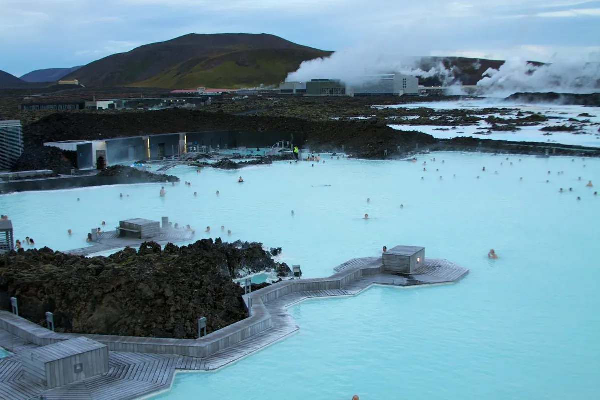 Bathers in the milky blue water of the Blue Lagoon near Fagradalsfjall volcano tours, Reykjanes, Iceland