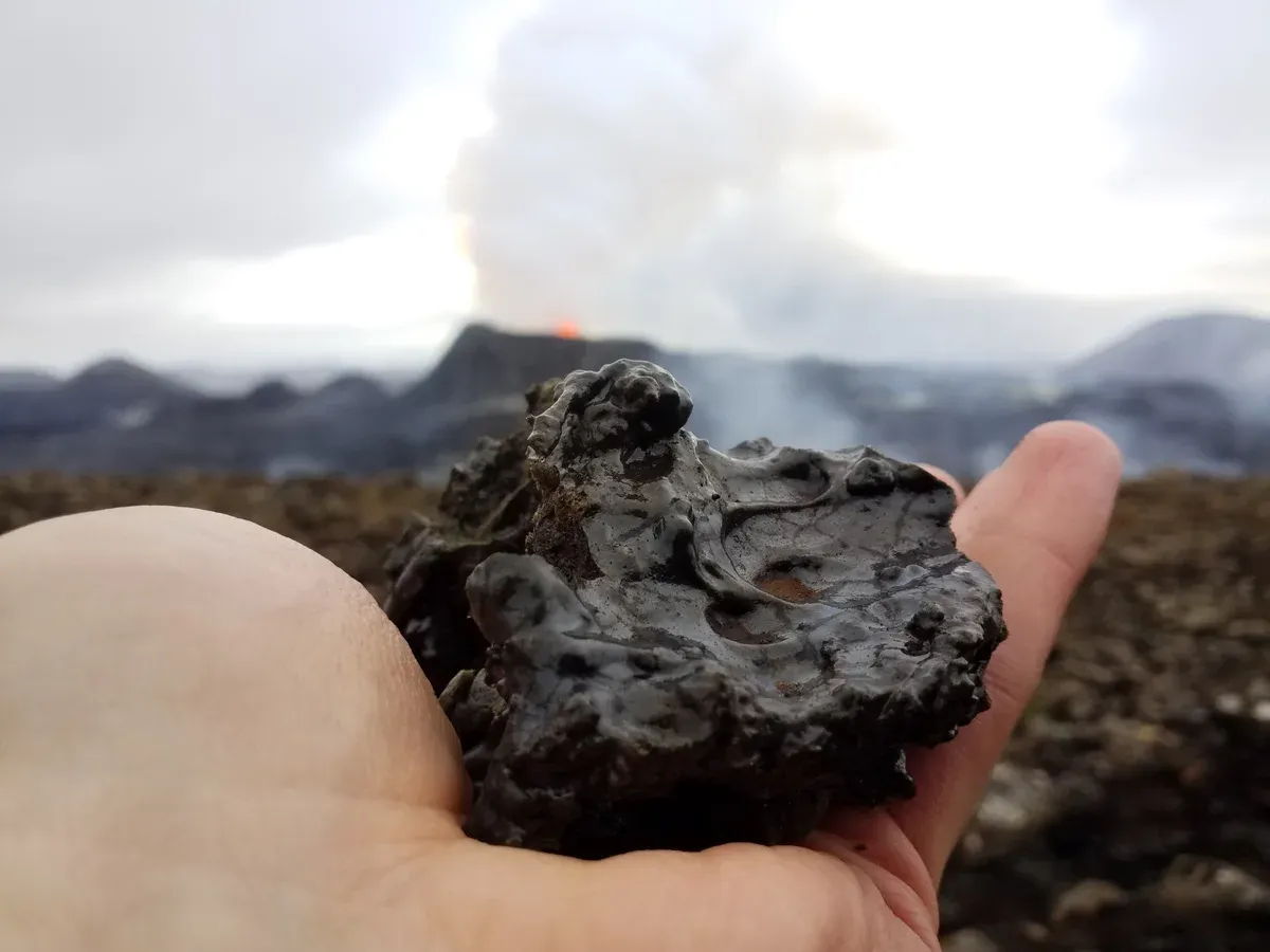 Close-up of volcanic lapilli fragments from the 2021 lava flow on a Fagradalsfjall volcano tour, Iceland