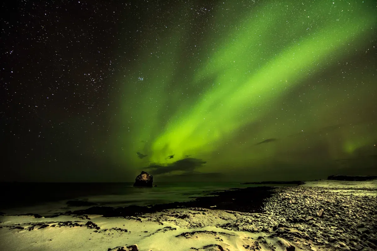 The northern lights over the Reykjanes Geopark near Fagradalsfjall volcano tours, Iceland