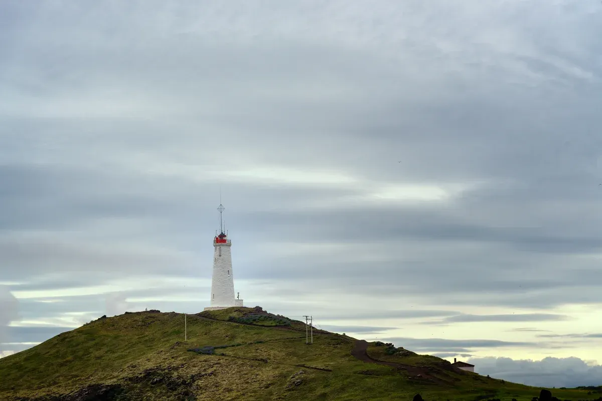 Reykjanesviti lighthouse on the cliffs above the Fagradalsfjall volcano tours coastline, Iceland